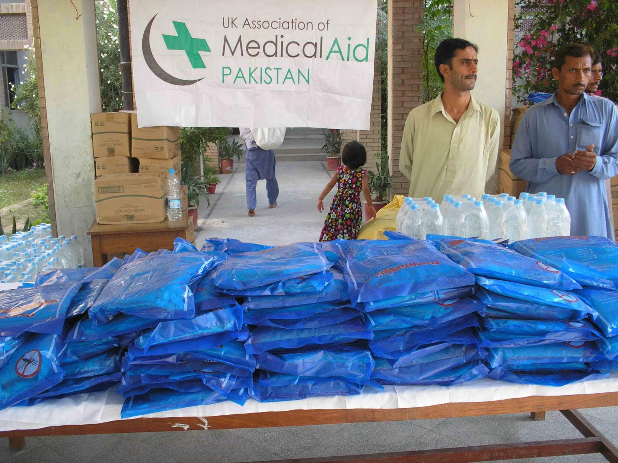 UKMAP relief distribution — nets and clean water prepared for families